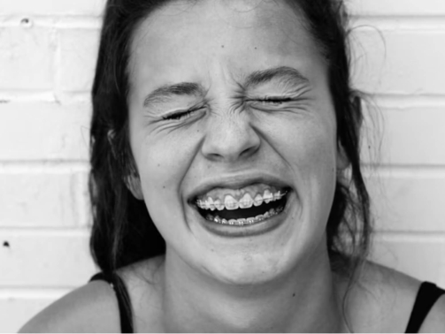 Girl with braces laughing